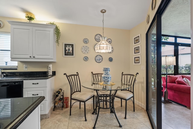 dining space featuring light tile patterned floors