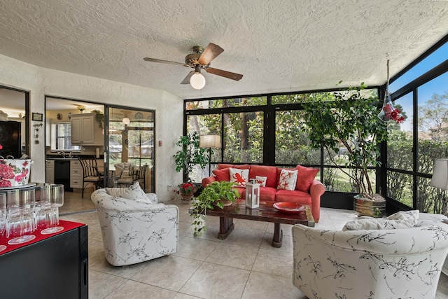 sunroom featuring ceiling fan