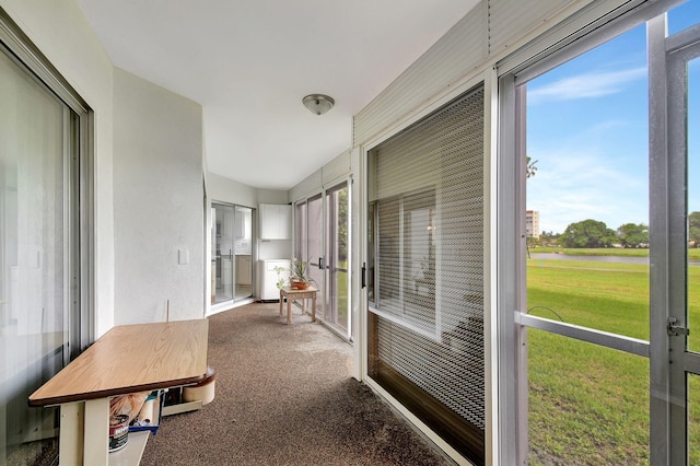 sunroom / solarium featuring plenty of natural light