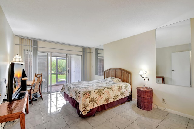 bedroom with access to outside, baseboards, and light tile patterned flooring