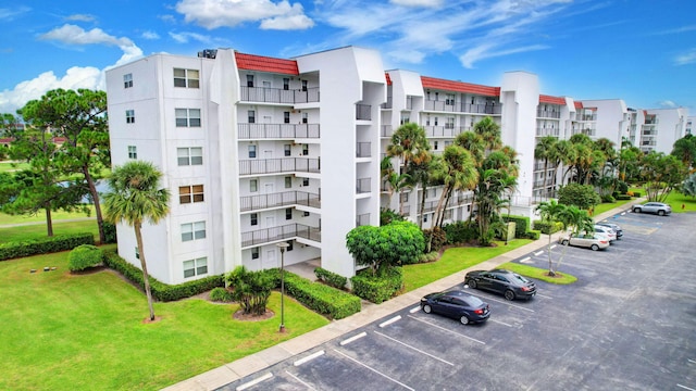 view of property with uncovered parking