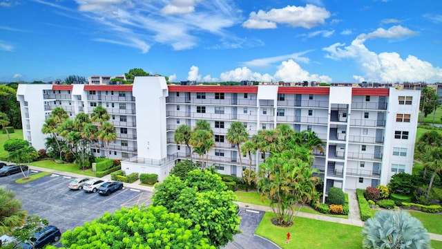 view of property with uncovered parking