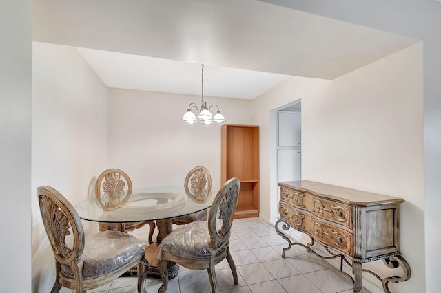 dining room featuring light tile patterned floors and an inviting chandelier