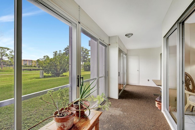 unfurnished sunroom featuring plenty of natural light