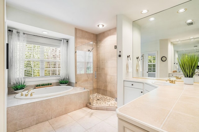 bathroom with vanity, plus walk in shower, and tile patterned floors