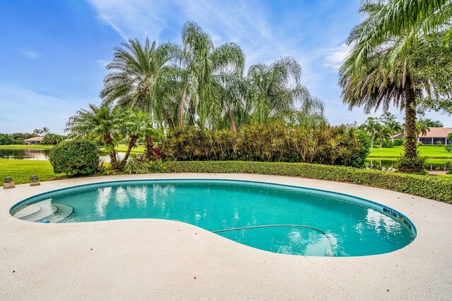 view of pool featuring a water view