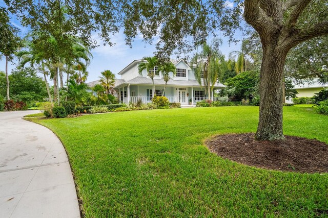 view of front of home with a front lawn and a porch