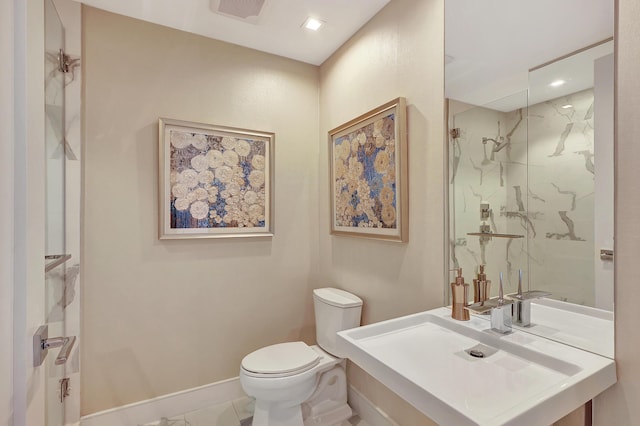 full bathroom featuring toilet, baseboards, visible vents, and a marble finish shower