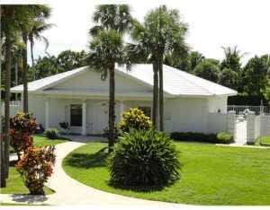 rear view of property featuring a yard
