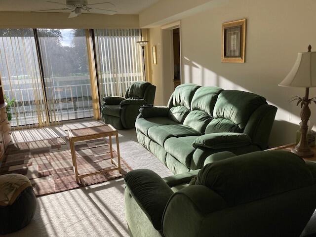 living area featuring ceiling fan