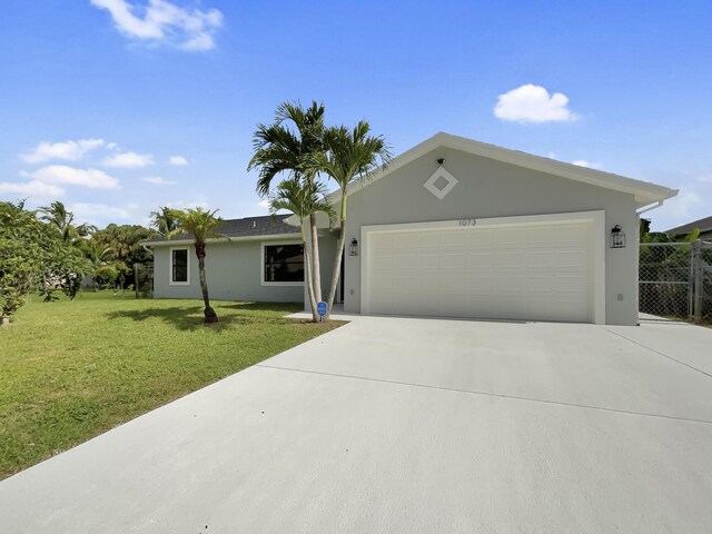 ranch-style home with a garage and a front yard