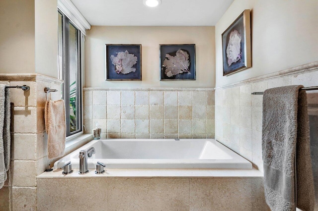 bathroom with tiled tub