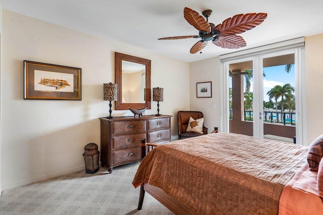 carpeted bedroom with access to exterior and ceiling fan