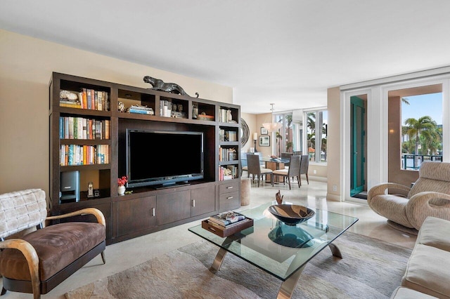 living room featuring a notable chandelier