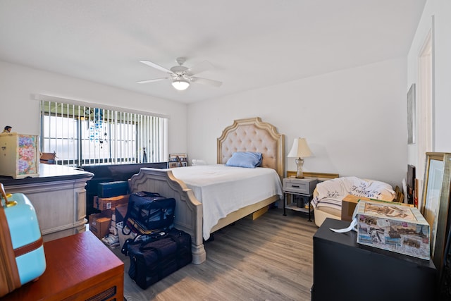 bedroom with ceiling fan and wood-type flooring