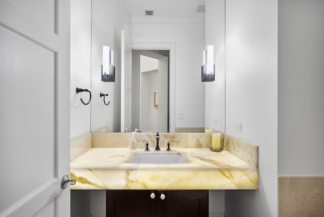 bathroom featuring vanity and ornamental molding