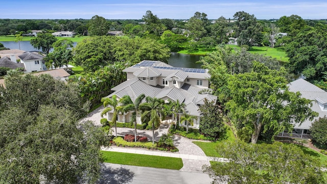 birds eye view of property with a water view