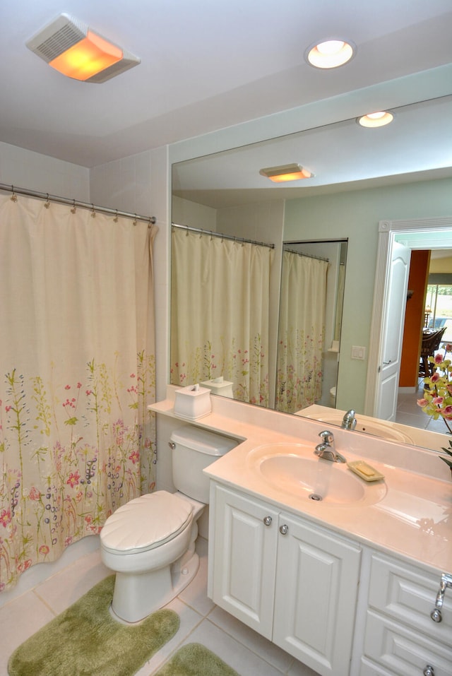 bathroom featuring tile patterned floors, vanity, and toilet