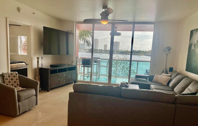 tiled living room with ceiling fan