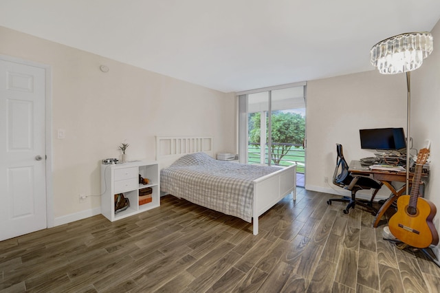 bedroom with dark hardwood / wood-style flooring and access to outside