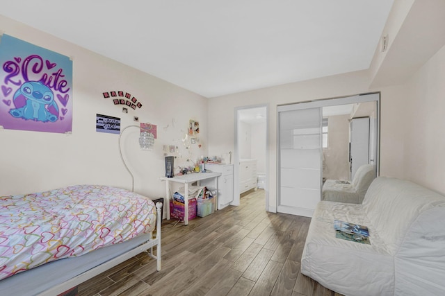 bedroom with dark wood-type flooring