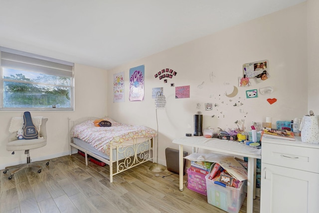 bedroom with light wood-type flooring