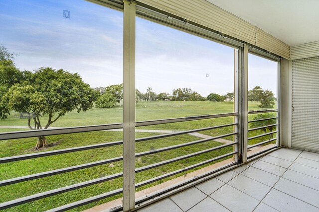 sunroom / solarium with a rural view