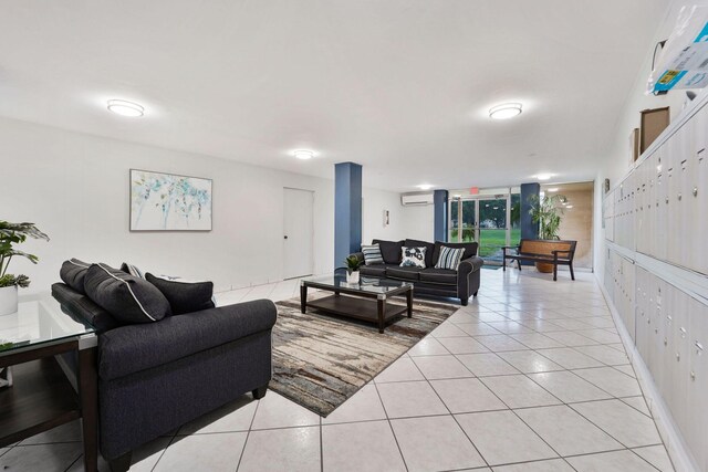 tiled living room featuring a wall mounted AC and floor to ceiling windows