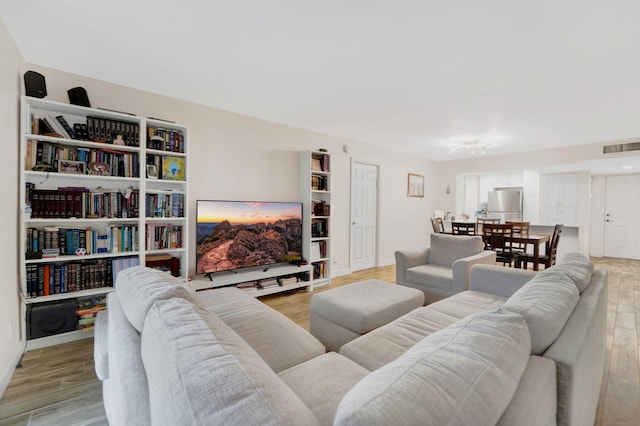 living room with light hardwood / wood-style flooring