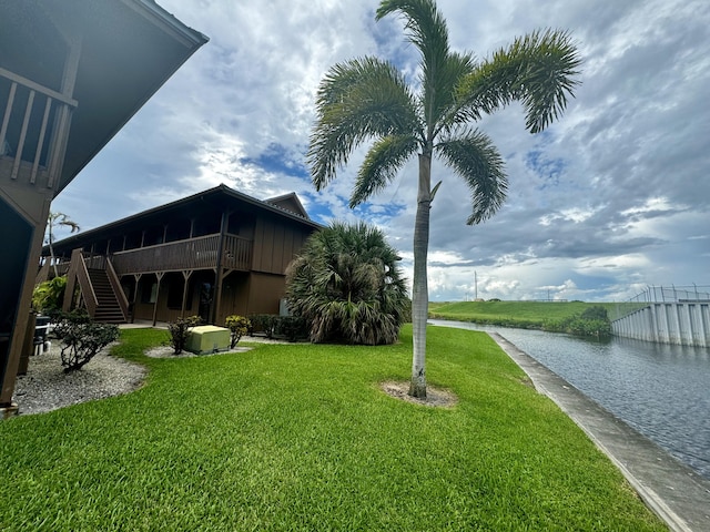 view of yard featuring a deck with water view