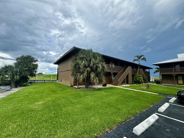 exterior space featuring a front yard and a deck