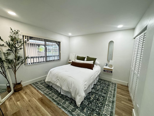 bedroom with wood-type flooring