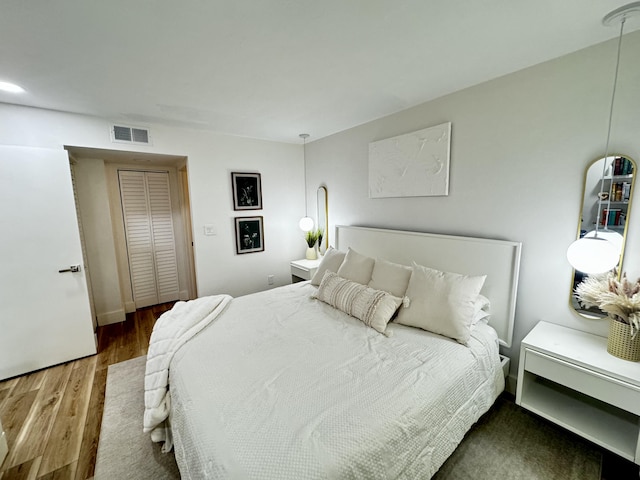 bedroom featuring dark hardwood / wood-style floors