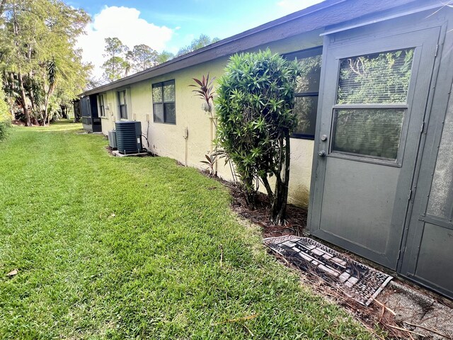 view of yard with central AC