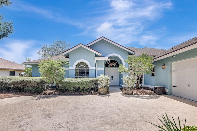 ranch-style house featuring a garage