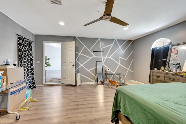 bedroom with ceiling fan, hardwood / wood-style flooring, and access to outside