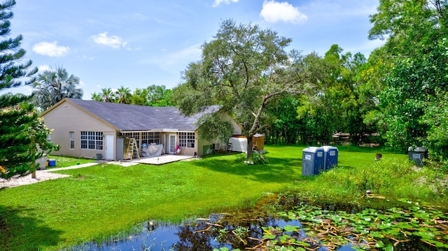 exterior space with a yard, a patio area, and a shed