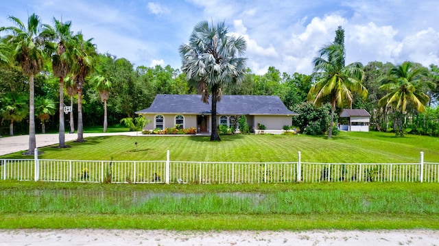 ranch-style house with a front yard