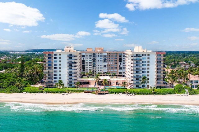 drone / aerial view featuring a view of the beach and a water view