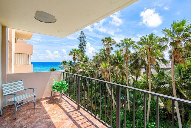 balcony featuring a water view