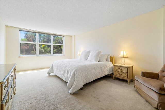 carpeted bedroom with a textured ceiling