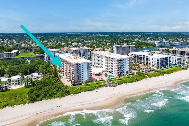 aerial view featuring a water view and a view of the beach