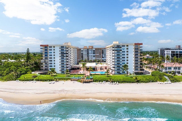 view of pool with a view of the beach and a water view