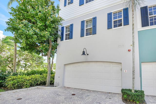 view of side of property featuring a garage