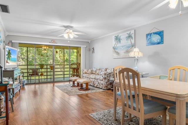 dining room featuring ornamental molding, ceiling fan, and hardwood / wood-style flooring