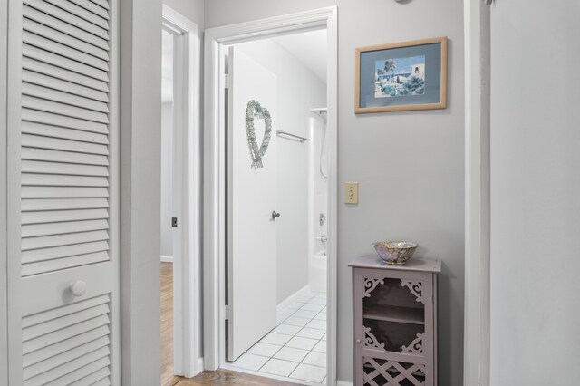 corridor with light hardwood / wood-style flooring