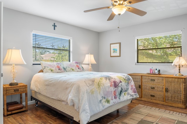 bedroom with hardwood / wood-style floors and ceiling fan