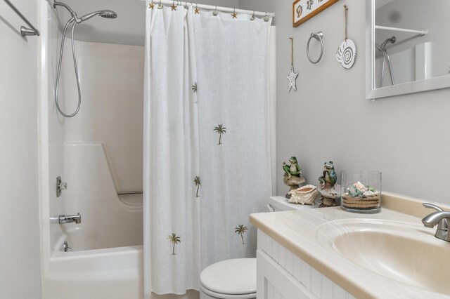 full bathroom featuring vanity, toilet, and shower / bath combination with curtain