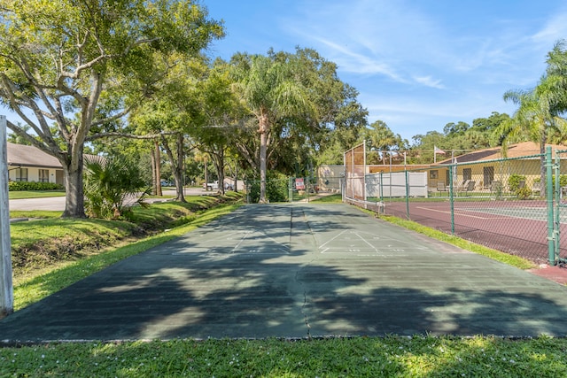 view of community with tennis court