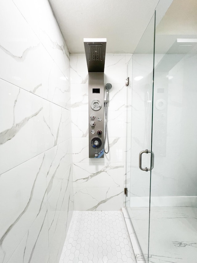 bathroom featuring an enclosed shower